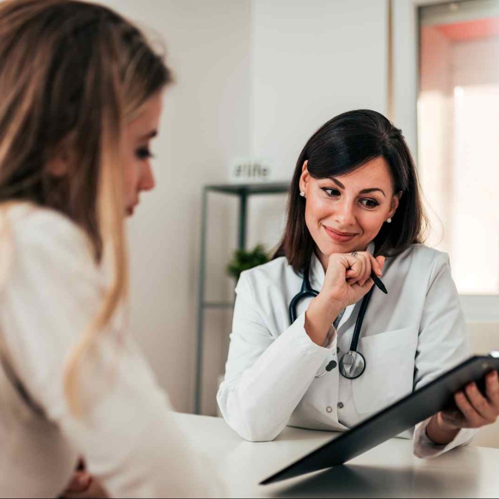 Hair loss doctor trichologist treating woman